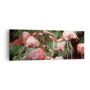 Bild auf Leinwand - Leinwandbild - Eine Gruppe von Flamingos in einer tropischen Umgebung, umgeben von Palmen - 140x50cm - Nachmittagsklatsch - Moderne Wanddekoration für Wohnzimmer und Schlafzimmer ARTTOR