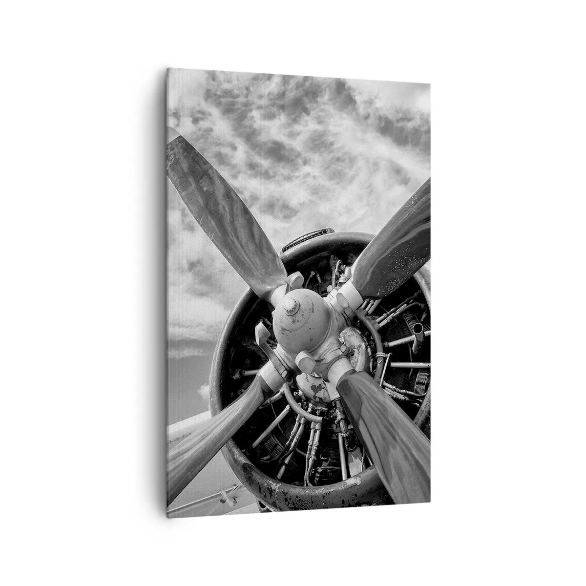 Bild auf Leinwand - Leinwandbild - Ein Schwarzweißfoto eines Flugzeugpropellers vor einem dynamischen Himmel. - 80x120cm - Eroberer der Lüfte - Moderne Wanddekoration für Wohnzimmer und Schlafzimmer ARTTOR