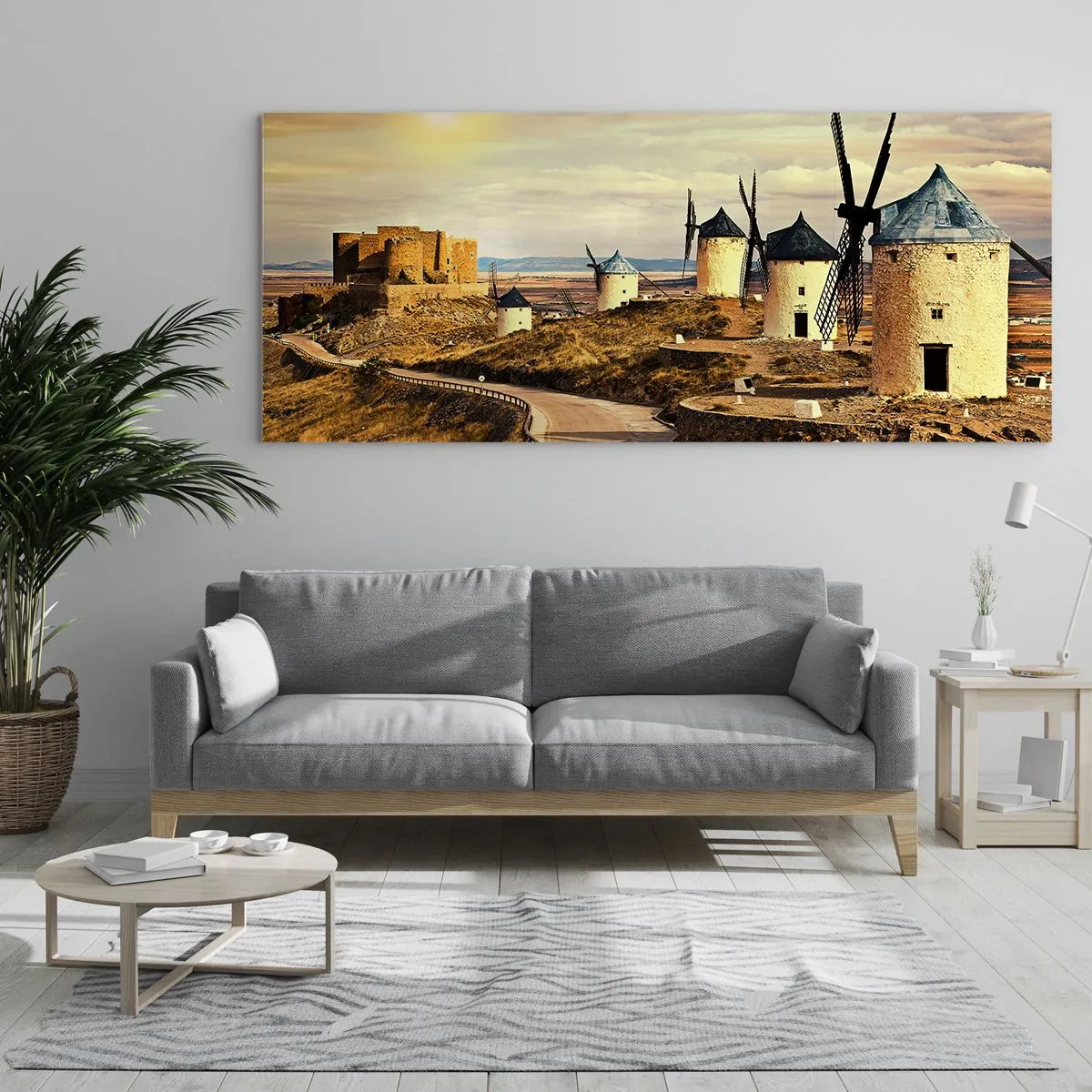 Glasbild - Bild auf glas - Windmühlen auf den Hügeln mit einer historischen Burg im Hintergrund - 160x50cm - Don Quijote kommt gleich - Moderne Wanddekoration für Wohnzimmer und Schlafzimmer ARTTOR