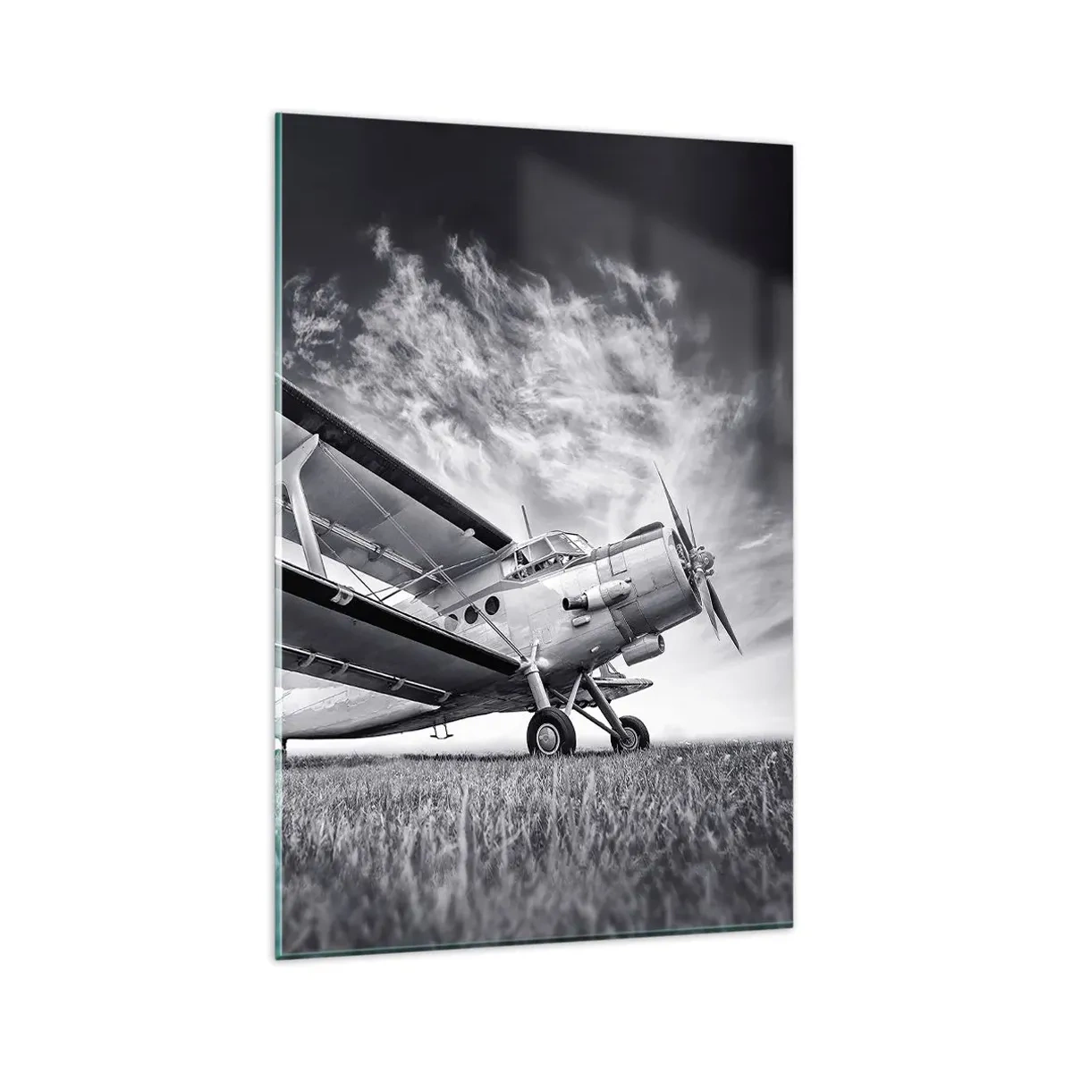 Glasbild - Bild auf glas - Ein Flugzeug vor einem dramatischen Himmel in Schwarzweiß - 80x120cm - Der geflügelte Wanderer - Moderne Wanddekoration für Wohnzimmer und Schlafzimmer ARTTOR