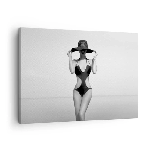 Bild auf Leinwand - Leinwandbild - Schwarz-weiße Silhouette einer Frau mit Hut vor dem Meereshintergrund - 70x50cm - Mein Name ist: Eleganz - Moderne Wanddekoration für Wohnzimmer und Schlafzimmer ARTTOR