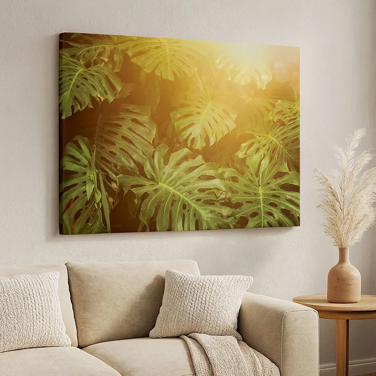 Bild auf Leinwand - Leinwandbild - Monstera-Blätter im Sonnenlicht vor einem natürlichen Hintergrund - 70x50cm - Ins Grüne tretren... - Moderne Wanddekoration für Wohnzimmer und Schlafzimmer ARTTOR