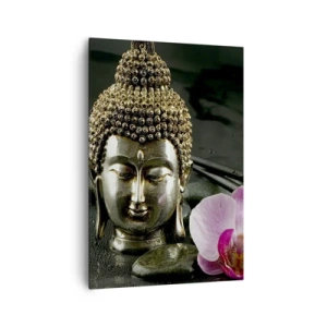 Bild auf Leinwand - Leinwandbild - Eine Buddha-Statuette mit Orchidee und Essstäbchen vor einem Hintergrund aus Steinen - 70x100cm - Harmonie von Weisheit und Schönheit - Moderne Wanddekoration für Wohnzimmer und Schlafzimmer ARTTOR