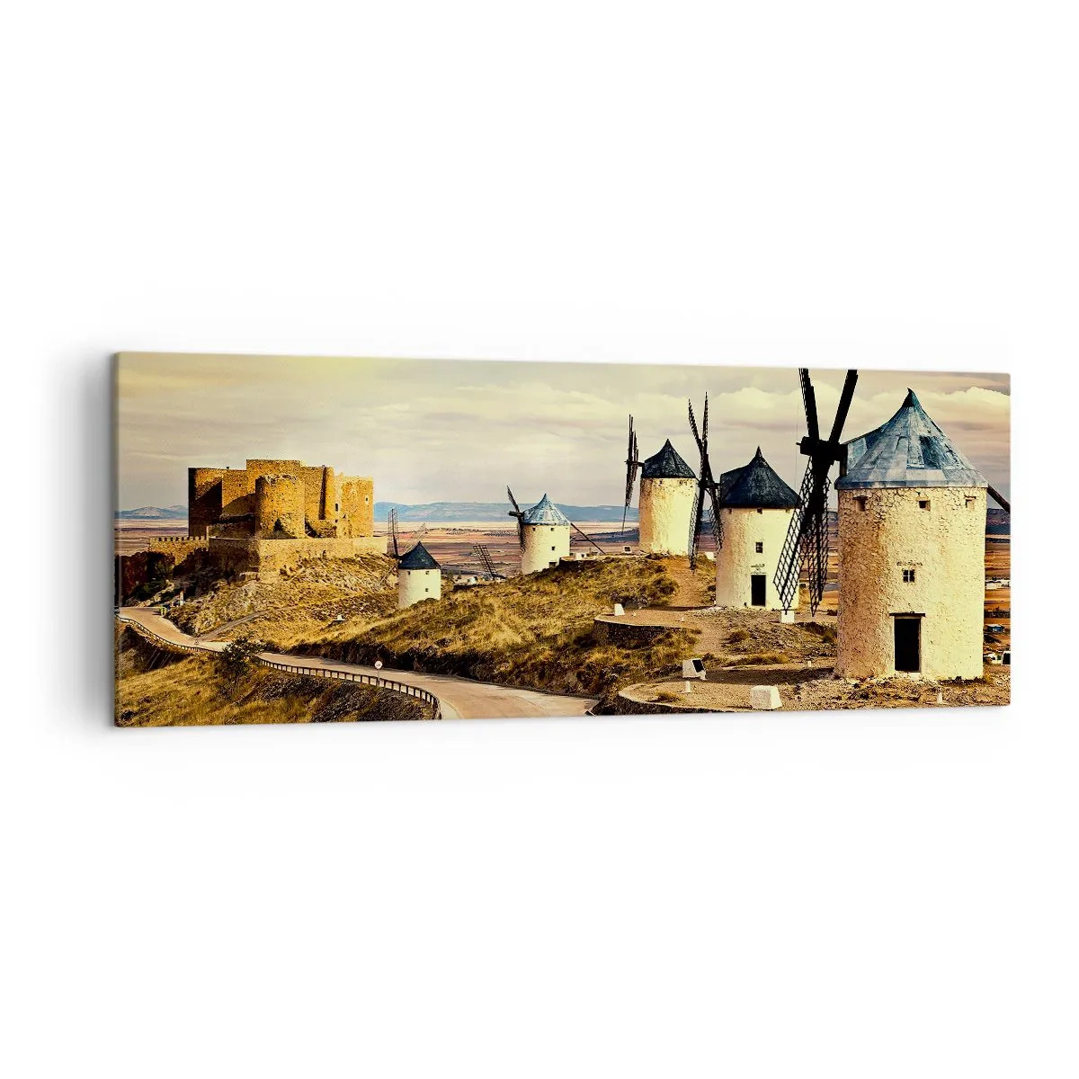 Bild auf Leinwand - Leinwandbild - Windmühlen auf den Hügeln mit einer historischen Burg im Hintergrund - 140x50cm - Don Quijote kommt gleich - Moderne Wanddekoration für Wohnzimmer und Schlafzimmer ARTTOR