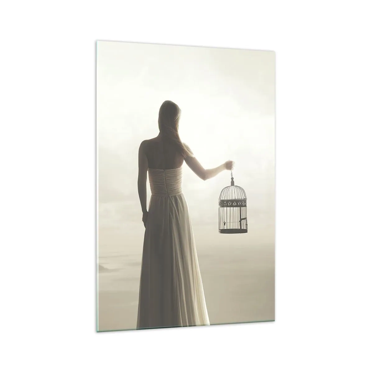 Glasbild - Bild auf glas - Eine Frau mit einem Käfig vor einem ruhigen Himmel - 70x100cm - Sei frei - Moderne Wanddekoration für Wohnzimmer und Schlafzimmer ARTTOR