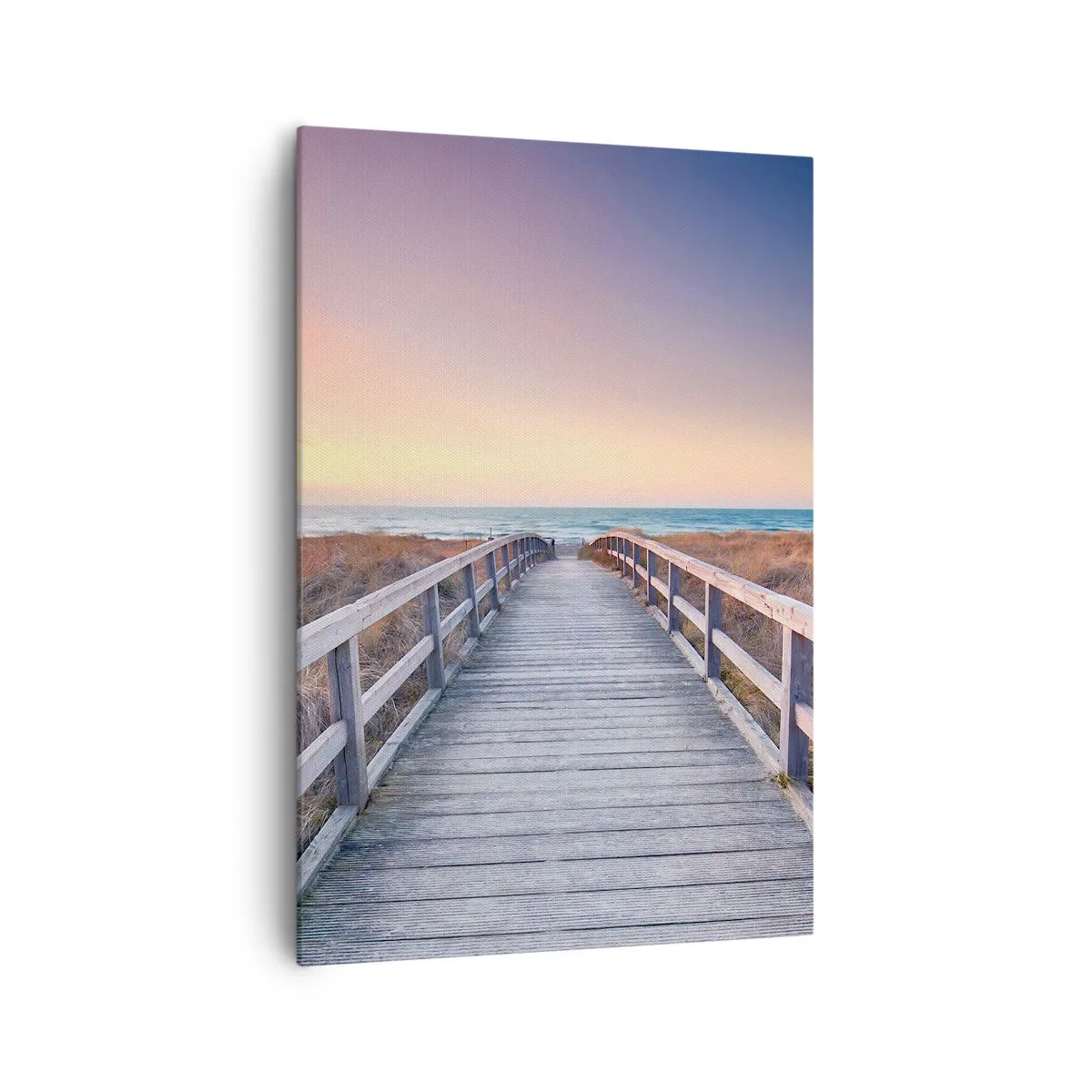 Bild auf Leinwand - Leinwandbild - Ein Holzsteg führt bei Sonnenuntergang zum Strand, der Himmel ist in Pastellfarben gemalt. - 70x100cm - Baltische Abend-Aurora - Moderne Wanddekoration für Wohnzimmer und Schlafzimmer ARTTOR