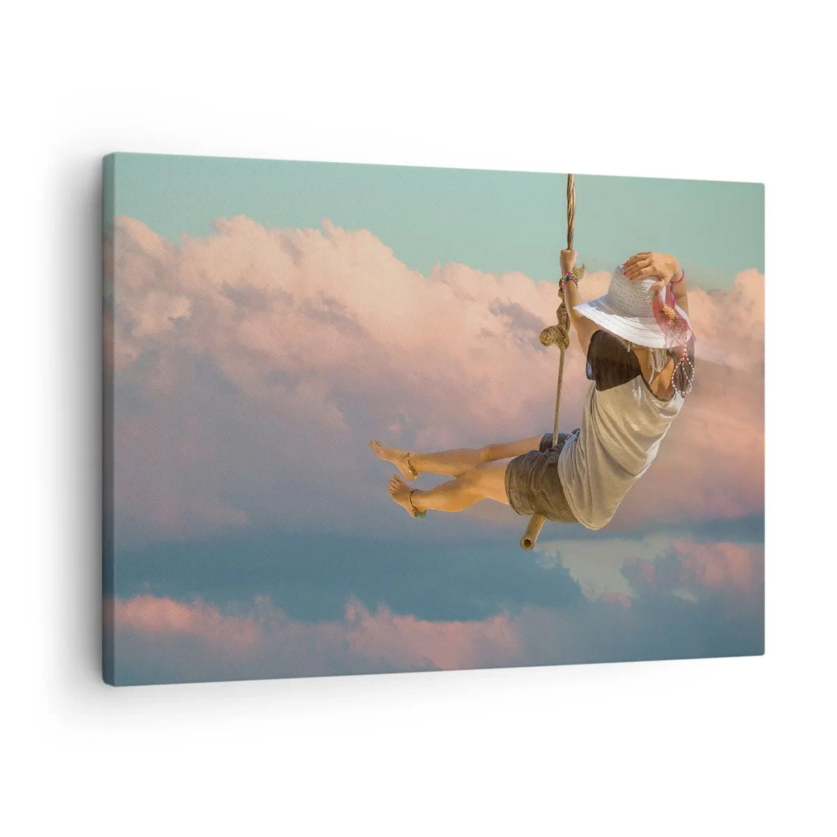 Bild auf Leinwand - Leinwandbild - Frau auf einer Schaukel zwischen rosa Wolken - 70x50cm - Spaß in den Wolken - Moderne Wanddekoration für Wohnzimmer und Schlafzimmer ARTTOR