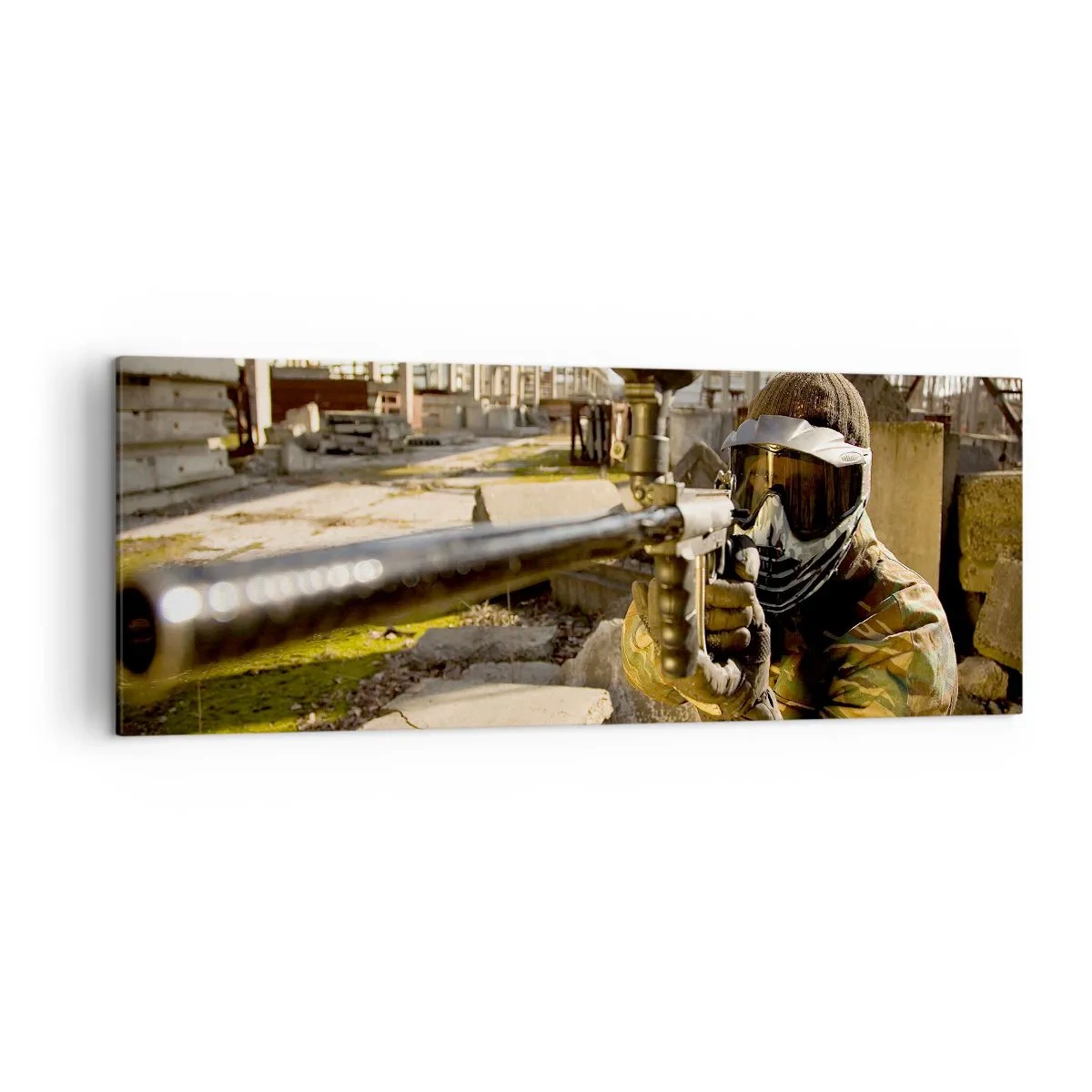 Bild auf Leinwand - Leinwandbild - Ein Paintball-Spieler in Tarnkleidung zielt mit einem Markierer - 140x50cm - Auch du kannst ein Held werden - Moderne Wanddekoration für Wohnzimmer und Schlafzimmer ARTTOR