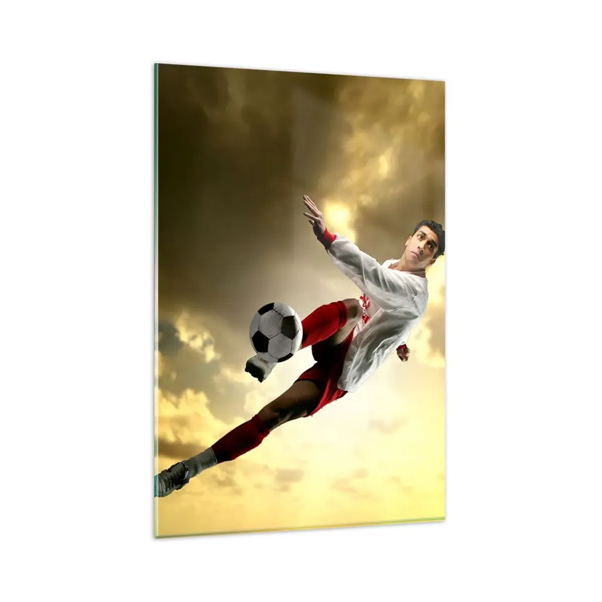 Glasbild - Bild auf glas - Ein Fußballspieler in einem dynamischen Sprung kickt den Ball in den Himmel - 80x120cm - Fußballhimmel - Moderne Wanddekoration für Wohnzimmer und Schlafzimmer ARTTOR