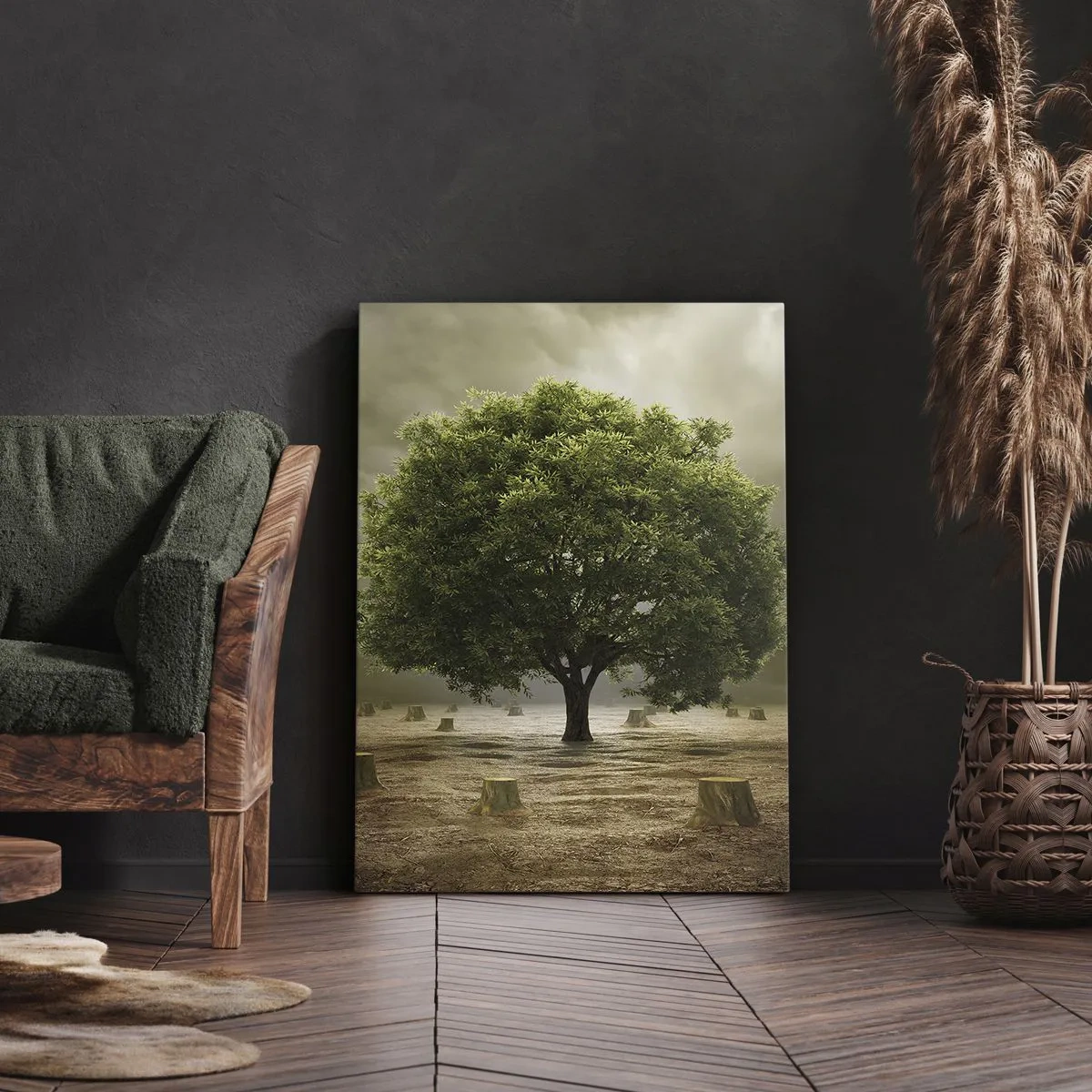 Bild auf Leinwand - Leinwandbild - Ein grüner Baum, umgeben von gefällten Baumstämmen vor einem bewölkten Himmel - 50x70cm - Alle Hoffnung - Moderne Wanddekoration für Wohnzimmer und Schlafzimmer ARTTOR