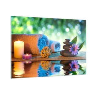 Glasbild - Bild auf glas - Spa mit Handtüchern, Kerzen und Steinen vor natürlicher Kulisse - 100x70cm - Zeit für den Körper - Moderne Wanddekoration für Wohnzimmer und Schlafzimmer ARTTOR