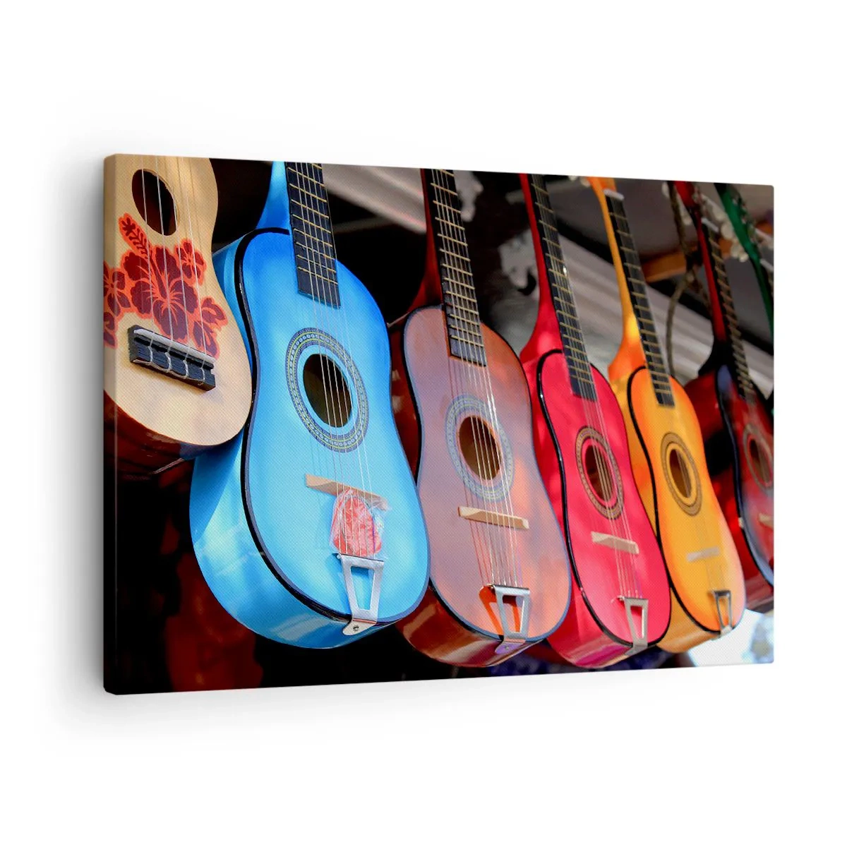 Bild auf Leinwand - Leinwandbild - Bunte Akustikgitarren hängen in einer Reihe auf dem Display - 70x50cm - Lateinische Atmosphäre - Moderne Wanddekoration für Wohnzimmer und Schlafzimmer ARTTOR
