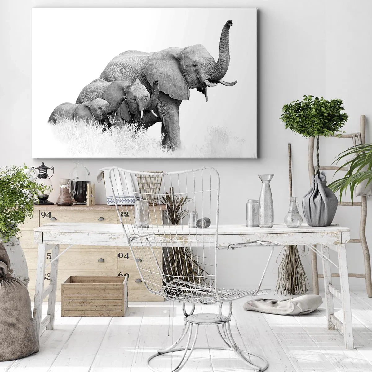 Bild auf Leinwand - Leinwandbild - Eine Elefantenfamilie vor einer afrikanischen Landschaft in Schwarzweiß. - 70x50cm - Eins zwei drei - Moderne Wanddekoration für Wohnzimmer und Schlafzimmer ARTTOR