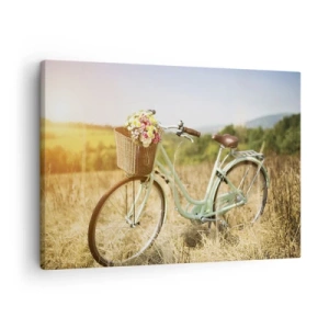 Bild auf Leinwand - Leinwandbild - Ein Retro-Fahrrad mit einem Korb voller Blumen vor einem Wiesenhintergrund. - 70x50cm - Ich bleibe eine Weile hier - Moderne Wanddekoration für Wohnzimmer und Schlafzimmer ARTTOR