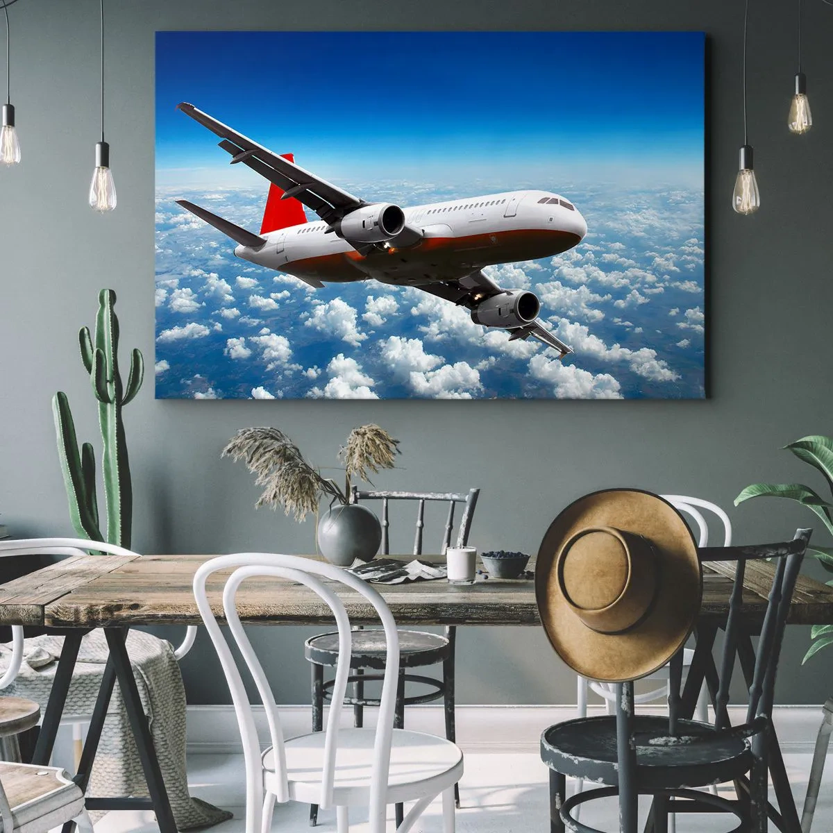 Bild auf Leinwand - Leinwandbild - Ein Passagierflugzeug fliegt über den Wolken vor einem blauen Himmel. - 70x50cm - Entferne dich von allem - Moderne Wanddekoration für Wohnzimmer und Schlafzimmer ARTTOR