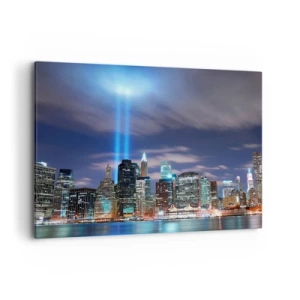 Bild auf Leinwand - Leinwandbild - Nachtstadtpanorama mit zwei hellen Lichtstrahlen am Himmel - 100x70cm - Erreiche den Himmel mit dem Licht - Moderne Wanddekoration für Wohnzimmer und Schlafzimmer ARTTOR