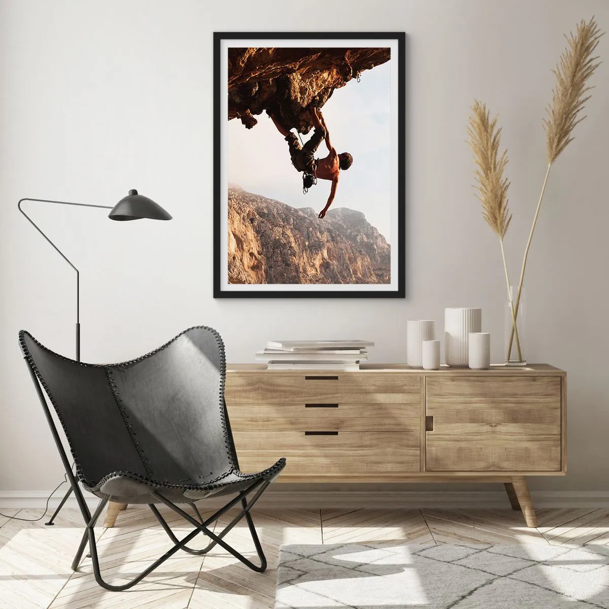 Poster in einem schwarzem Rahmen - Die Welt ist in einer Hand auf einem Felsblock geschrumpft - 70x100 cm