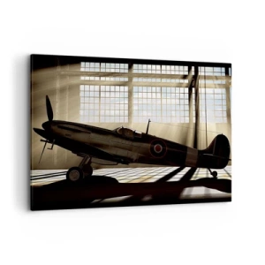Bild auf Leinwand - Leinwandbild - Ein historisches Flugzeug in einem Hangar, beleuchtet vom Sonnenlicht - 100x70cm - Die Ruhe eines Kriegers - Moderne Wanddekoration für Wohnzimmer und Schlafzimmer ARTTOR