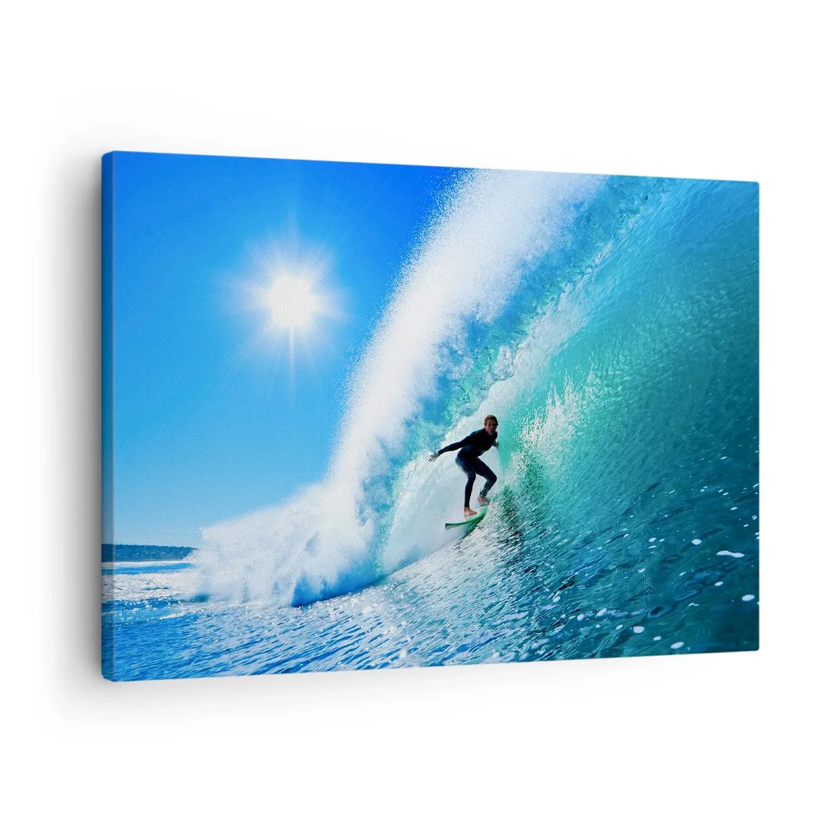 Bild auf Leinwand - Leinwandbild - Ein Surfer auf einem Brett reitet unter blauem Himmel auf einer starken Welle. - 70x50cm - Durch das große Blau - Moderne Wanddekoration für Wohnzimmer und Schlafzimmer ARTTOR