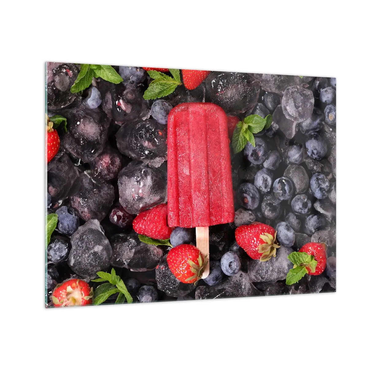 Glasbild - Bild auf glas - Ein Eisstiel zwischen gefrorenen Früchten und Minzblättern - 70x50cm - So schmeckt der heiße Sommer - Moderne Wanddekoration für Wohnzimmer und Schlafzimmer ARTTOR