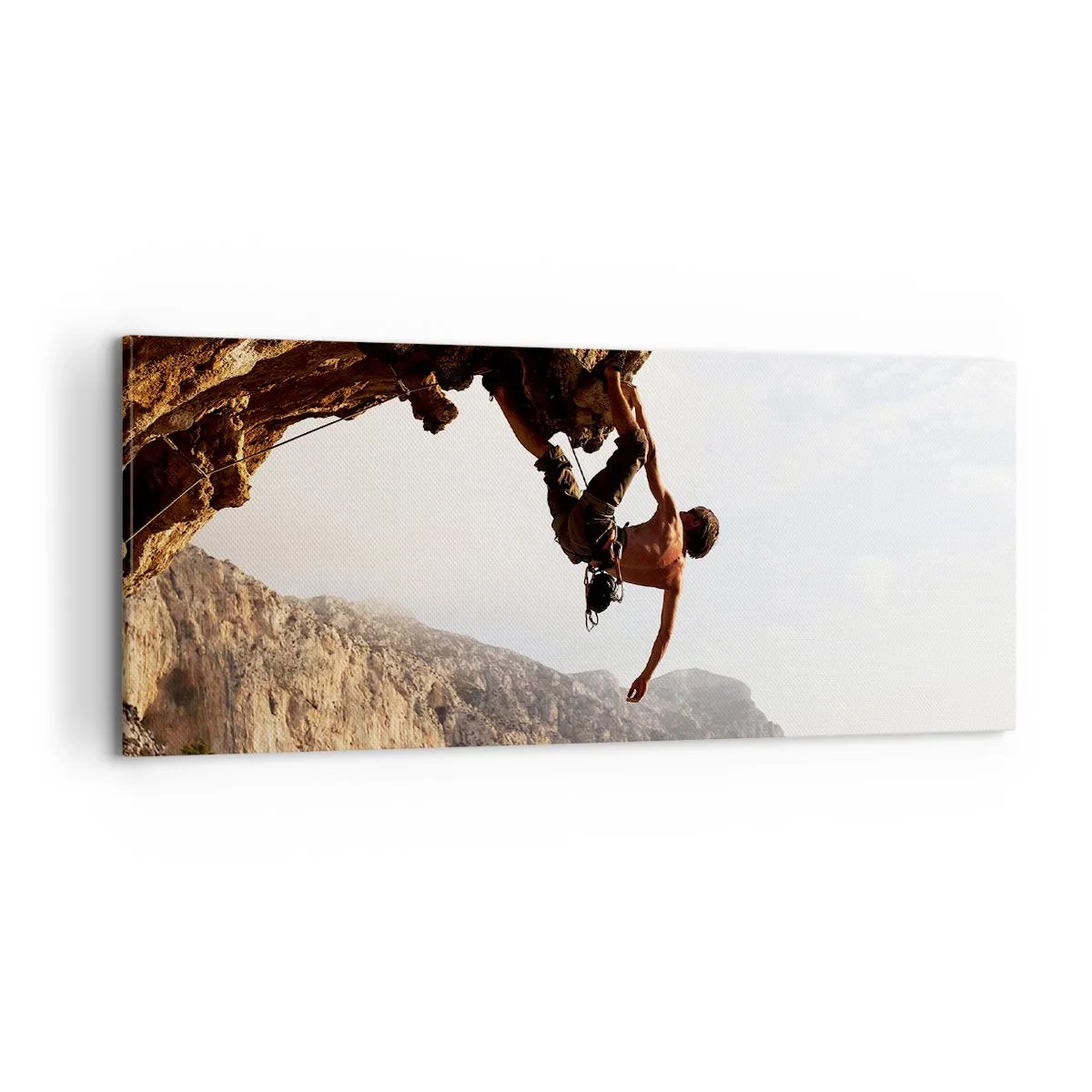 Bild auf Leinwand - Leinwandbild - Die Welt ist in einer Hand auf einem Felsblock geschrumpft - 100x40 cm