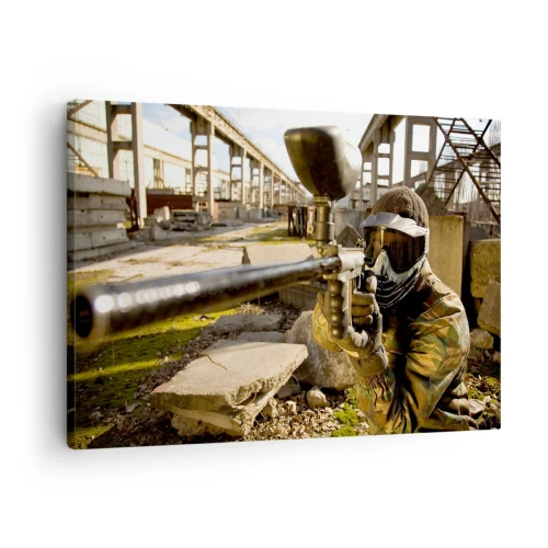 Bild auf Leinwand - Leinwandbild - Ein Paintball-Spieler in Tarnkleidung zielt mit einem Markierer - 70x50cm - Auch du kannst ein Held werden - Moderne Wanddekoration für Wohnzimmer und Schlafzimmer ARTTOR