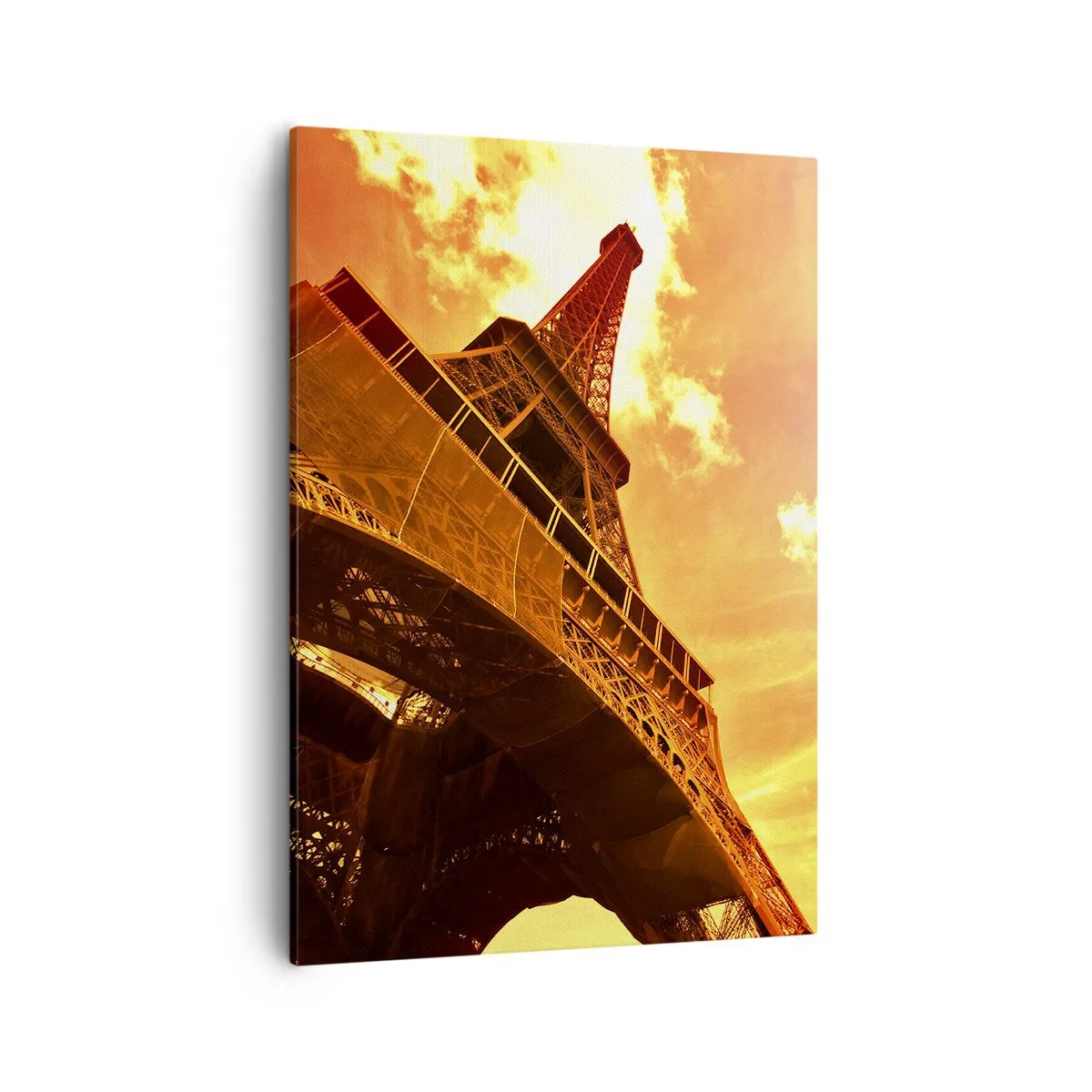 Bild auf Leinwand - Leinwandbild - Der Eiffelturm vor einem goldenen Himmel bei Sonnenuntergang - 50x70cm - Monumental, weil es mit der Sonne vergoldet ist - Moderne Wanddekoration für Wohnzimmer und Schlafzimmer ARTTOR