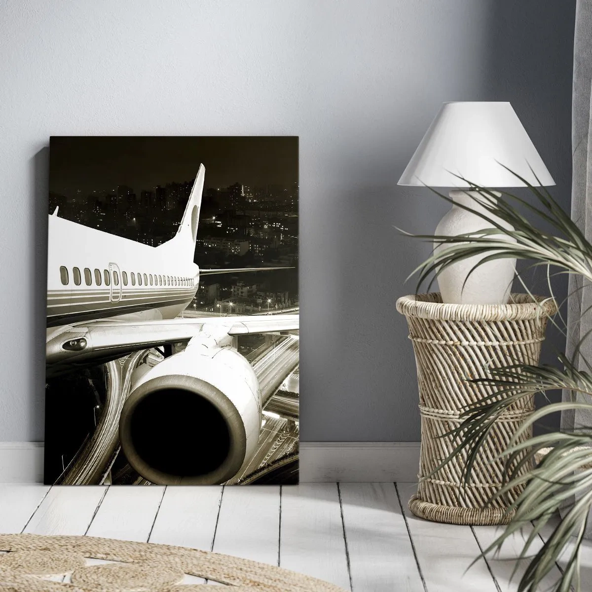 Bild auf Leinwand - Leinwandbild - Ein Flugzeug über einer nächtlichen Stadt mit beleuchteten Autobahnen - 80x120cm - In die Nacht fliegen - Moderne Wanddekoration für Wohnzimmer und Schlafzimmer ARTTOR